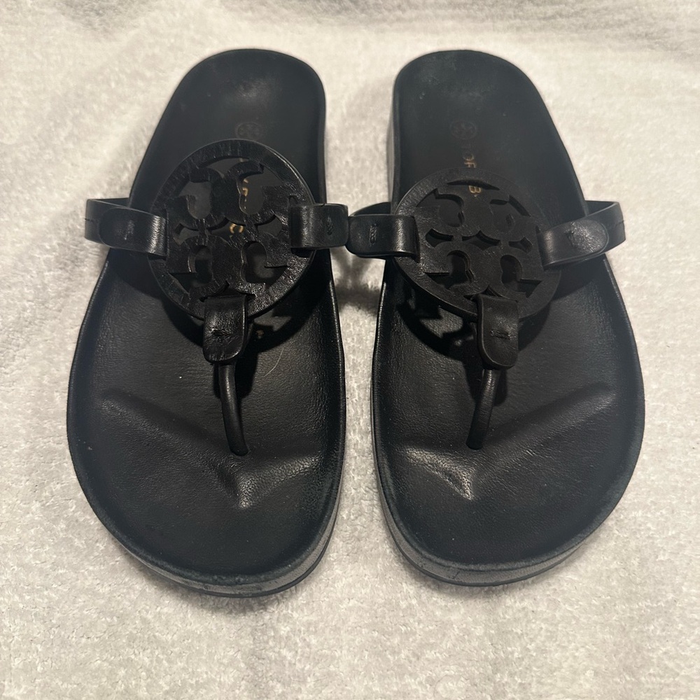 Tory Burch Black Sandals with Elegant Medallion